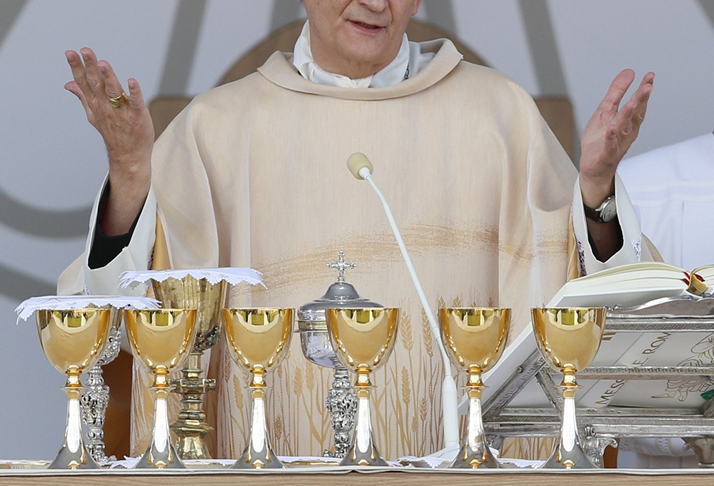 A cardinal celebrates the Eucharist during Italy's National Eucharistic Congress at the municipal stadium in Matera, Italy, Sept. 25, 2022. (CNS/Paul Haring)