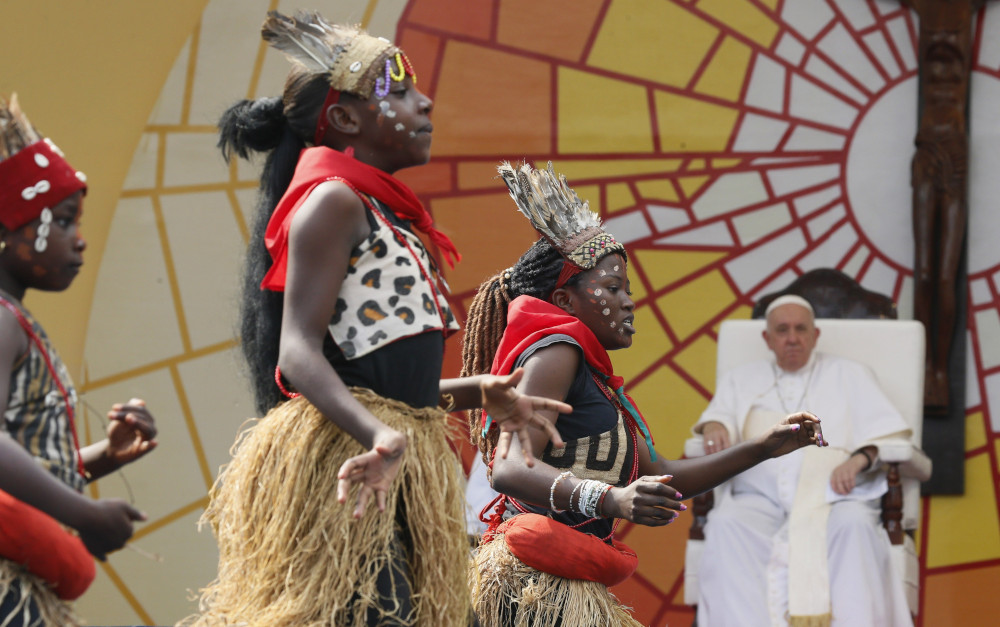 Pope Francis watches as dancers perform during a meeting with young people and catechists in Martyrs' Stadium in Kinshasa, Congo, Feb. 2, 2023. (CNS photo/Paul Haring)