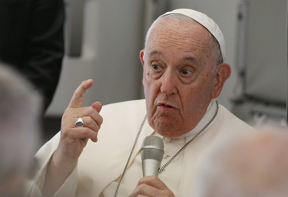 Pope Francis answers questions from journalists aboard the flight from Juba, South Sudan, to Rome Feb. 5. (CNS/Paul Haring)