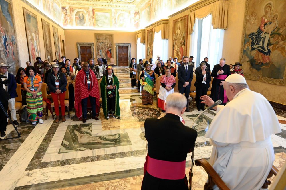Pope Francis gives his blessing to participants from the International Fund for Agricultural Development's Indigenous Peoples' Forum during an audience at the Vatican Feb. 10, 2023. (CNS photo/Vatican Media)