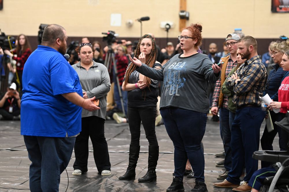 Residents of East Palestine, Ohio, and the surrounding community gather at a town hall meeting Feb. 15, 2023, to discuss safety and other environmental they have following a train derailment that spilled toxic chemicals Feb. 3. (OSV News photo/Reuters/Alan Freed)