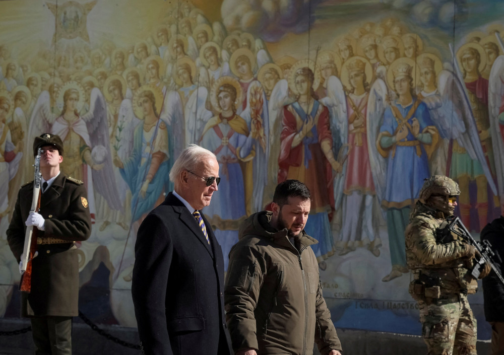 U.S. President Joe Biden and Ukrainian President Volodymyr Zelensky walk next to St. Michael's Orthodox Cathedral in Kyiv Feb. 20, 2023. (OSV News photo/Gleb Garanich, Reuters)