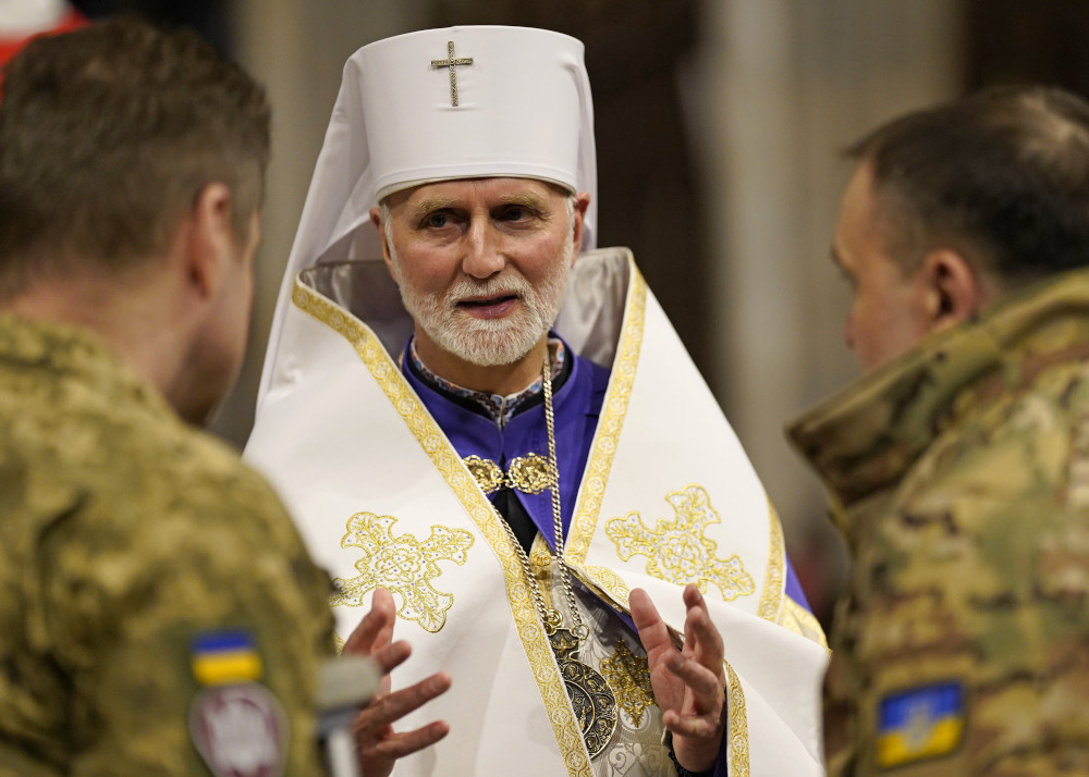 Metropolitan Archbishop Borys Gudziak of the Ukrainian Catholic Archeparchy of Philadelphia speaks with wounded Ukrainian soldiers following an ecumenical prayer service for peace in Ukraine at St. Patrick's Cathedral in New York City Feb. 18, 2023. (OSV News photo/Gregory A. Shemitz)