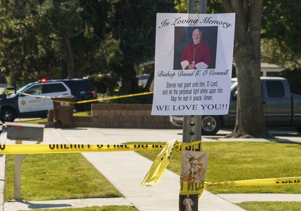 An image of Los Angeles Auxiliary Bishop David O'Connell is seen on the post of a street sign near his home in Hacienda Heights, California, Feb. 19. (AP/Damian Dovarganes)