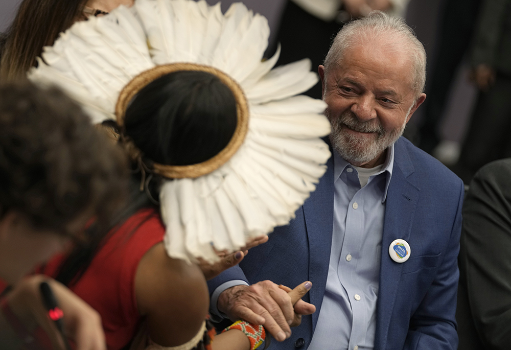 Puyr Tembe, leadership from Brazil's Indigenous People Articulation, left, greets Brazilian President-elect Luiz Inacio Lula da Silva at the COP27 U.N. climate summit Nov. 17, 2022, in Sharm el-Sheikh, Egypt. (AP photo/Peter Dejong)