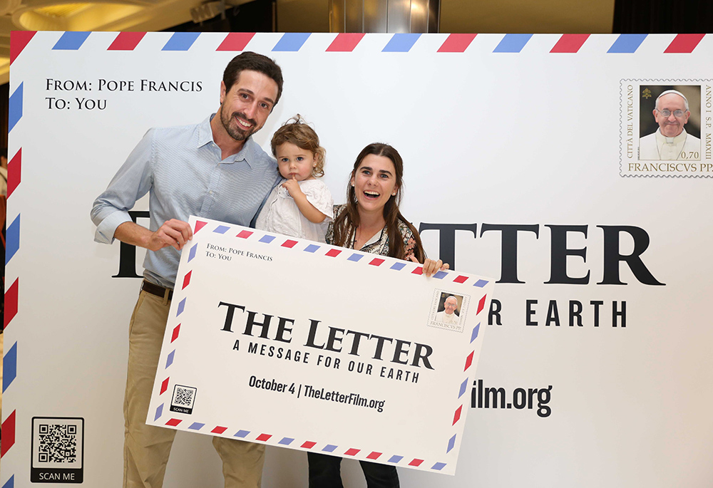 Tomás Insua, executive director of Laudato Si' Movement, poses with his family during the premiere of the documentary film "The Letter" Oct. 4, 2022, at the Vatican. (Laudato Si' Movement)