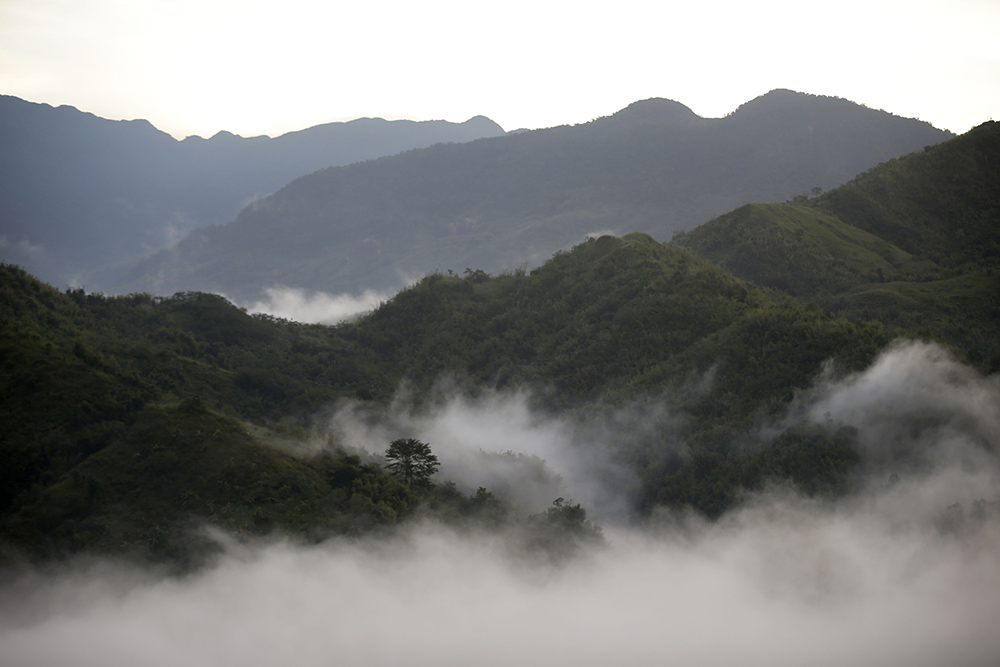 Clouds cover the Sierra Madre mountain range at sunrise as seen from Rodriguez township, Rizal province, Philippines. (AP/Bullit Marquez)