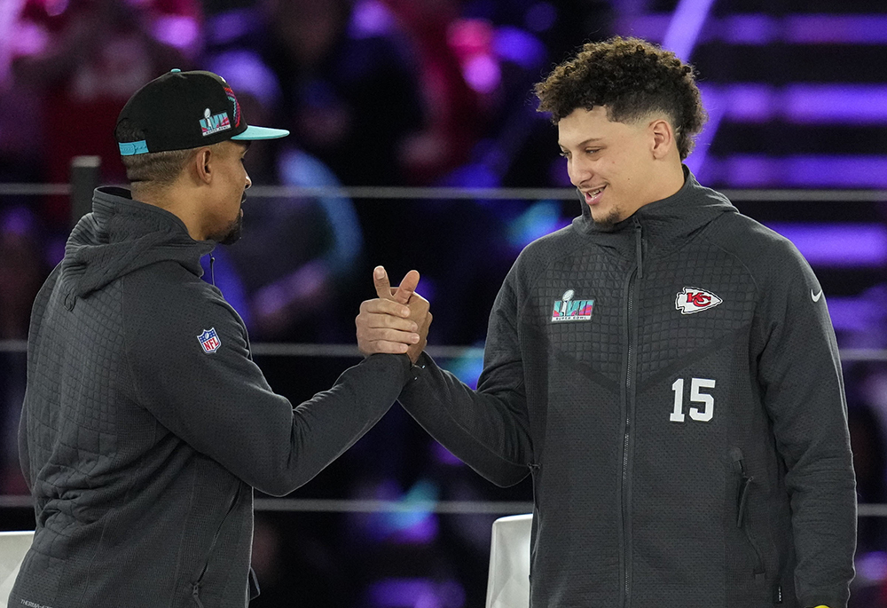 Philadelphia Eagles quarterback Jalen Hurts, left, and Kansas City Chiefs quarterback Patrick Mahomes shake hands during the NFL football Super Bowl 57 opening night, Monday, Feb. 6, 2023, in Phoenix. The Kansas City Chiefs will play the Philadelphia Eagles on Sunday, Feb. 12. (AP photo/Ross D. Franklin)