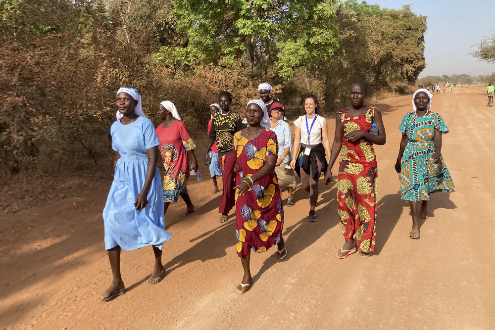 Women are seen walking as part of a group of 80 youth who joined a "Walking for Peace" pilgrimage with Catholic Bishop Christian Carlassare of Rumbek in central South Sudan, Anglican Bishop Alapayo Manyang Kuctiel of Rumbek and Rin Tueny, the governor of Lakes State. Pilgrimage participants were walking 12 to 15 miles and then driving 13 to 16 miles daily for nine days to meet Pope Francis in the capital of South Sudan, Juba, upon his arrival Feb. 3. (OSV News/Twitter/Courtesy of Sr. Orla Treacy)