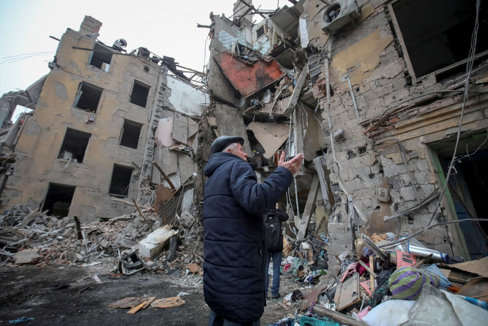 A local resident gestures outside a residential building in Kramatorsk, Ukraine, Feb. 2, 2022, which was destroyed by a Russian missile strike. (OSV News/Reuters/Vyacheslav Madiyevskyy)