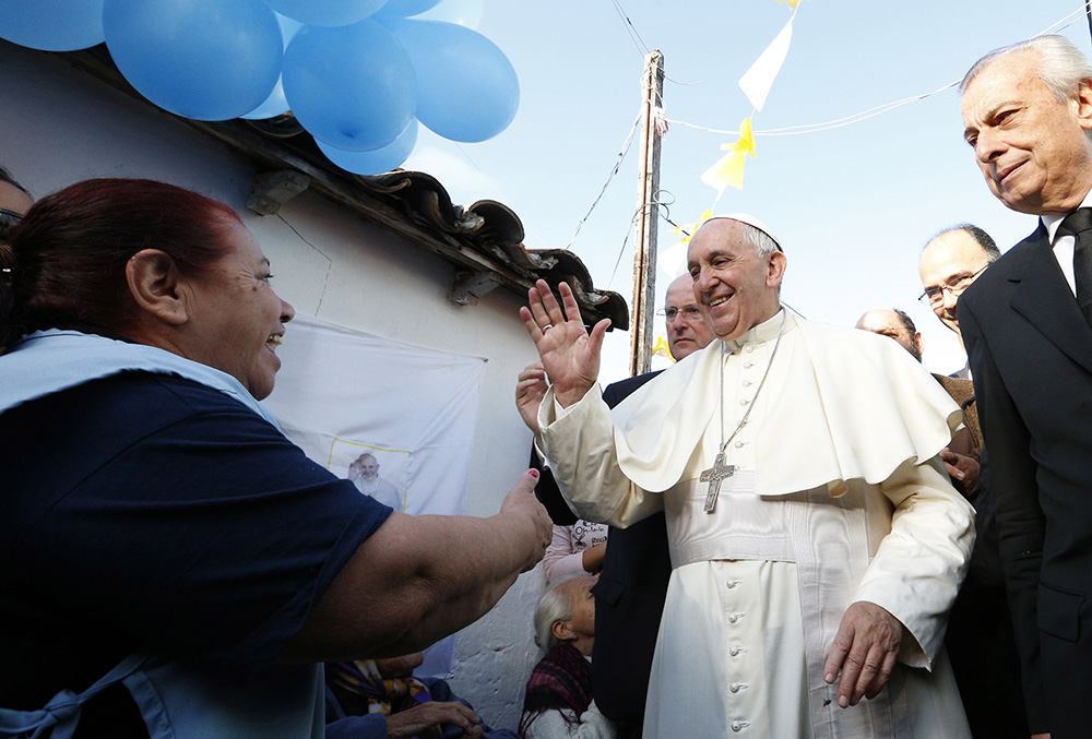 Pope Francis meets with people of Banado Norte, a poor neighborhood in Asunción, Paraguay, July 12, 2015. (CNS/Paul Haring)