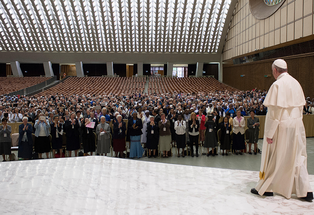 Pope Francis arrives for an audience with the heads of women's religious orders in the Paul VI hall May 12, 2016, at the Vatican. During a question-and-answer session with members of the International Union of Superiors General, the pope said he was willing to establish a commission to study whether women could serve as deacons. (CNS/L'Osservatore Romano)