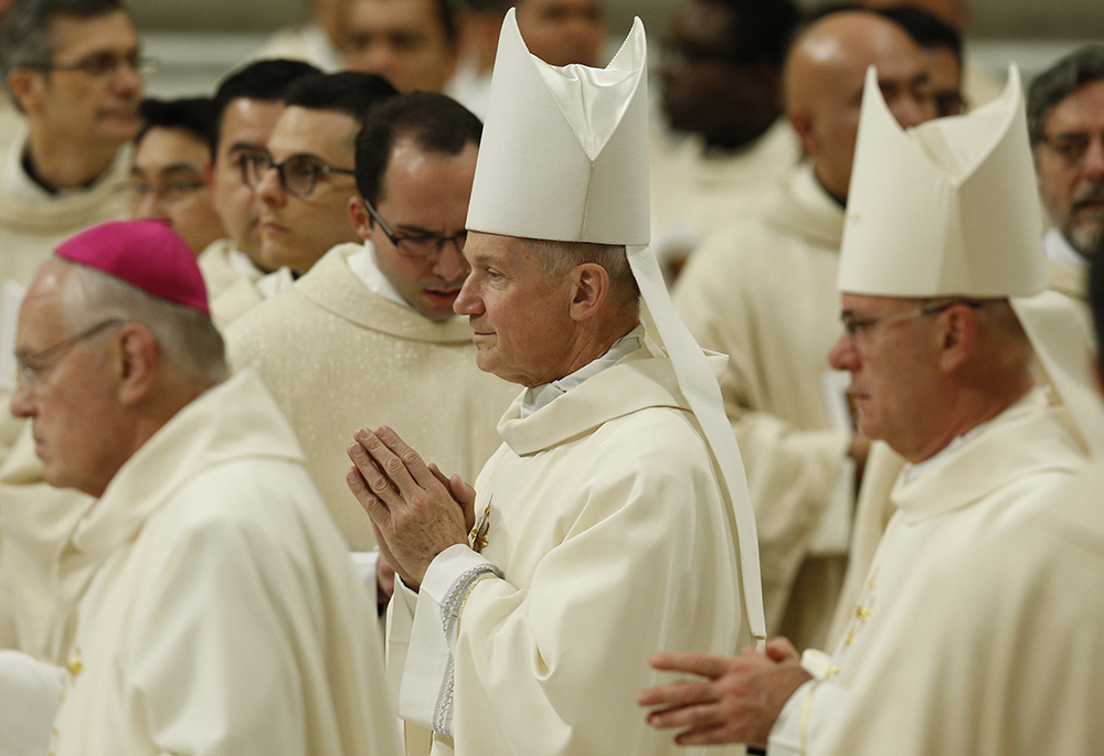 Bishop Thomas Paprocki of Springfield, Illinois, center, arrives in procession for Pope Francis' celebration of Mass marking the feast of Our Lady of Guadalupe in St. Peter's Basilica Dec. 12, 2019, at the Vatican. In attendance were U.S. bishops from Illinois, Indiana, and Wisconsin making their "ad limina" visits to the Vatican. (CNS/Paul Haring)