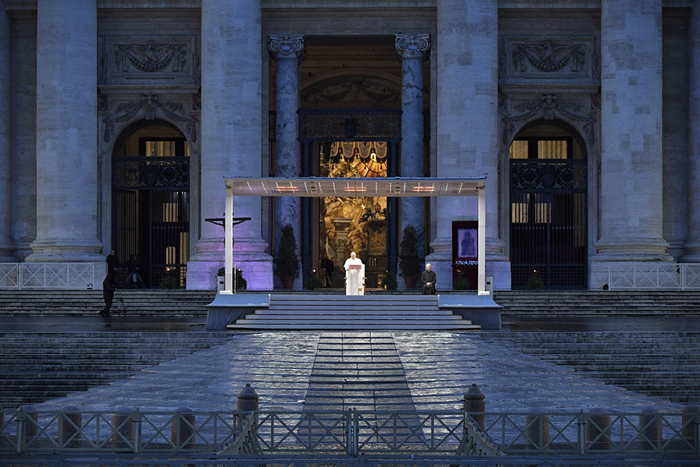 Pope Francis leads a prayer service in an empty St. Peter's Square at the Vatican March 27, 2020. At the conclusion of the service the pope held the Eucharist as he gave an extraordinary blessing urbi et orbi ("to the city and the world"). The service was livestreamed in the midst of the coronavirus pandemic. (CNS/Vatican Media)