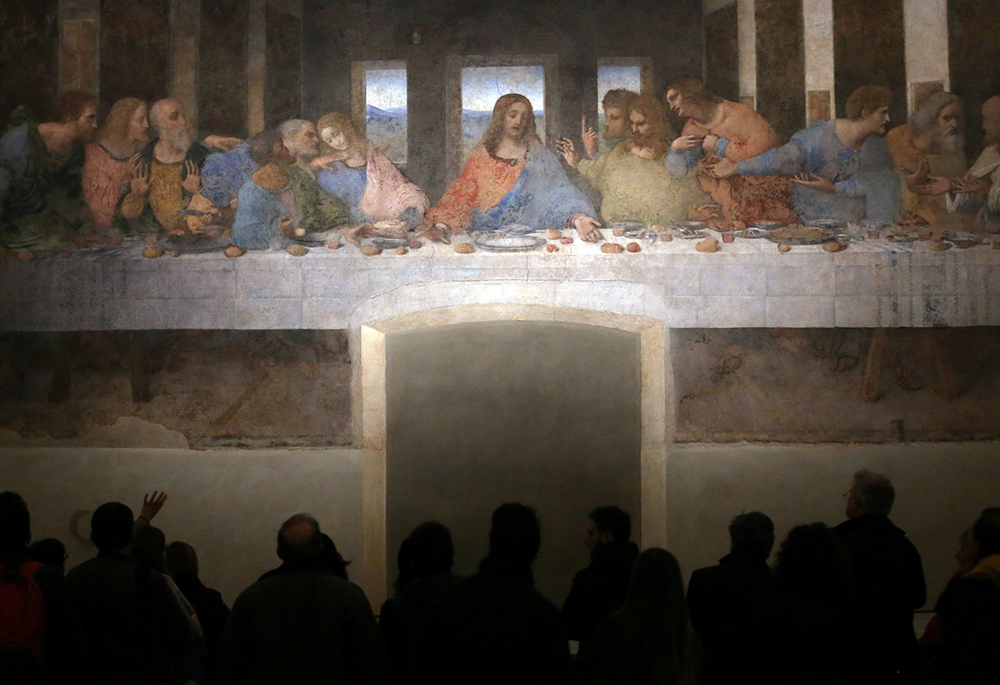 Visitors look at Leonardo da Vinci's "The Last Supper" on a refectory wall at Santa Maria delle Grazie Church in Milan. (CNS/Reuters/Stefano Rellandini)