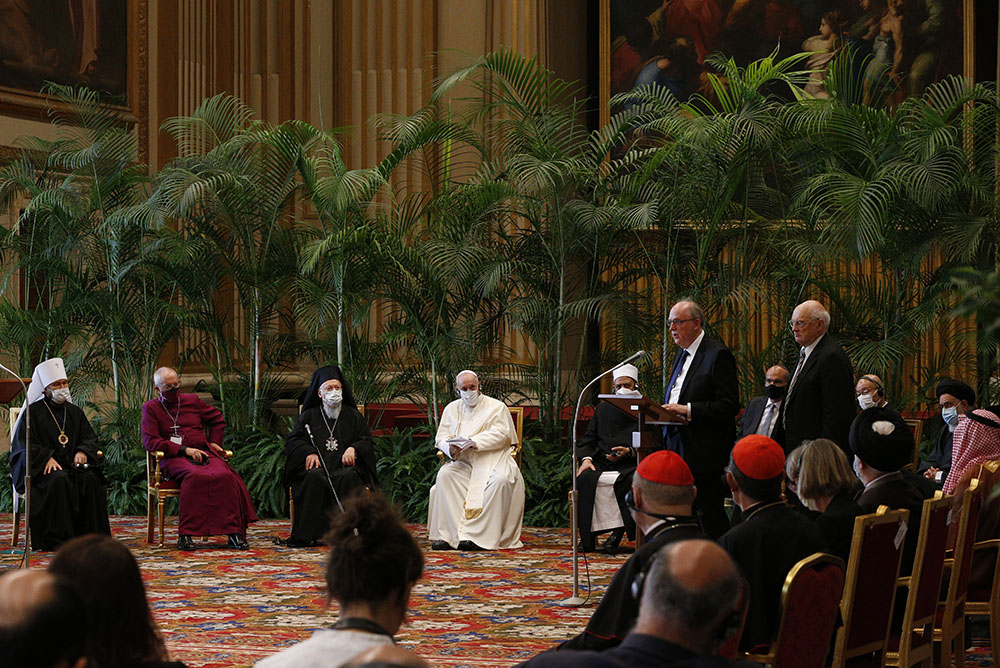 Pope Francis listens as Joachim Von Braun, president of the Pontifical Academy of Sciences, addresses the meeting "Faith and Science: Towards COP26" with religious leaders in the Hall of Benedictions at the Vatican Oct. 4, 2021. The meeting was part of the run-up to the U.N. climate change conference, called COP26, in Glasgow, Scotland, Oct. 31-Nov. 12, 2021. (CNS/Paul Haring)