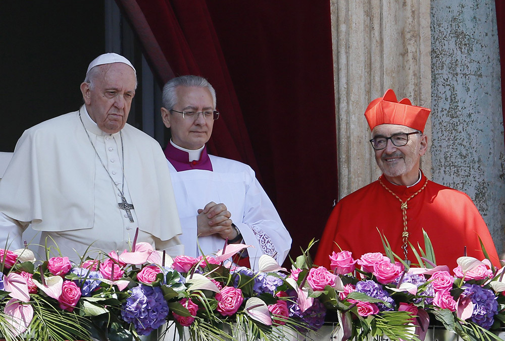 Cardinal Michael Czerny looks on as Pope Francis delivers his Easter message and blessing urbi et orbi ("to the city and the world") from the central balcony of St. Peter's Basilica at the Vatican April 17, 2022. (CNS/Paul Haring)