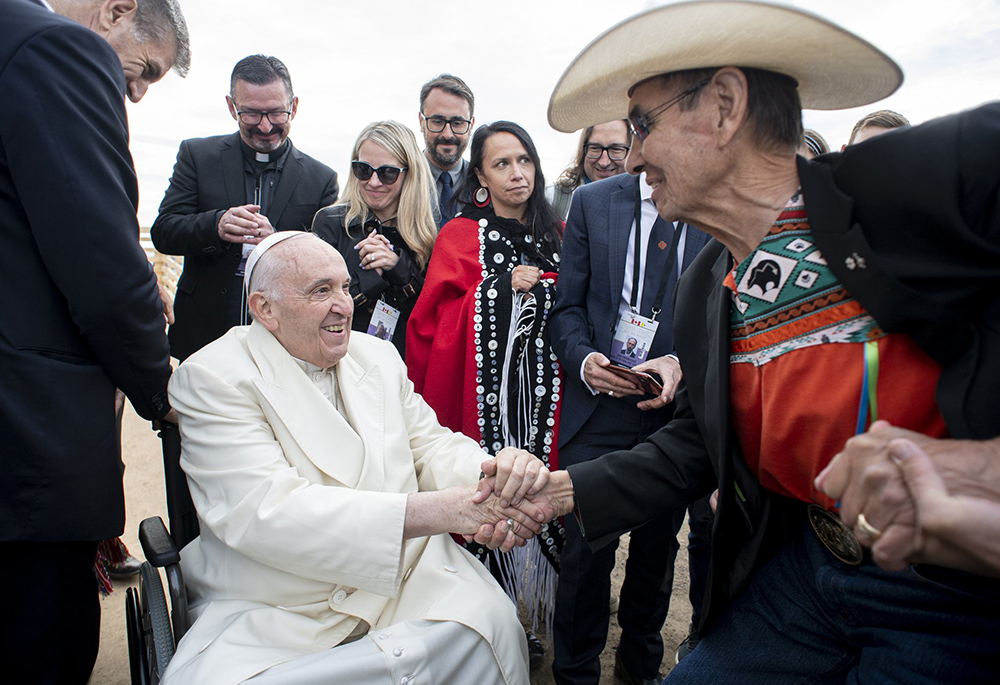 Pope Francis and Chief Wilton Littlechild say farewell to each other July 29, 2022, in Iqaluit, Nunavut, as the pope prepares to return to the Vatican after a six-day visit. Littlechild, a 78-year-old lawyer, survivor of abuse in a residential school and former grand chief of the Confederacy of Treaty Six First Nations, had lobbied hard for the pope to visit Canada and apologize to residential school survivors. (CNS/Vatican Media)
