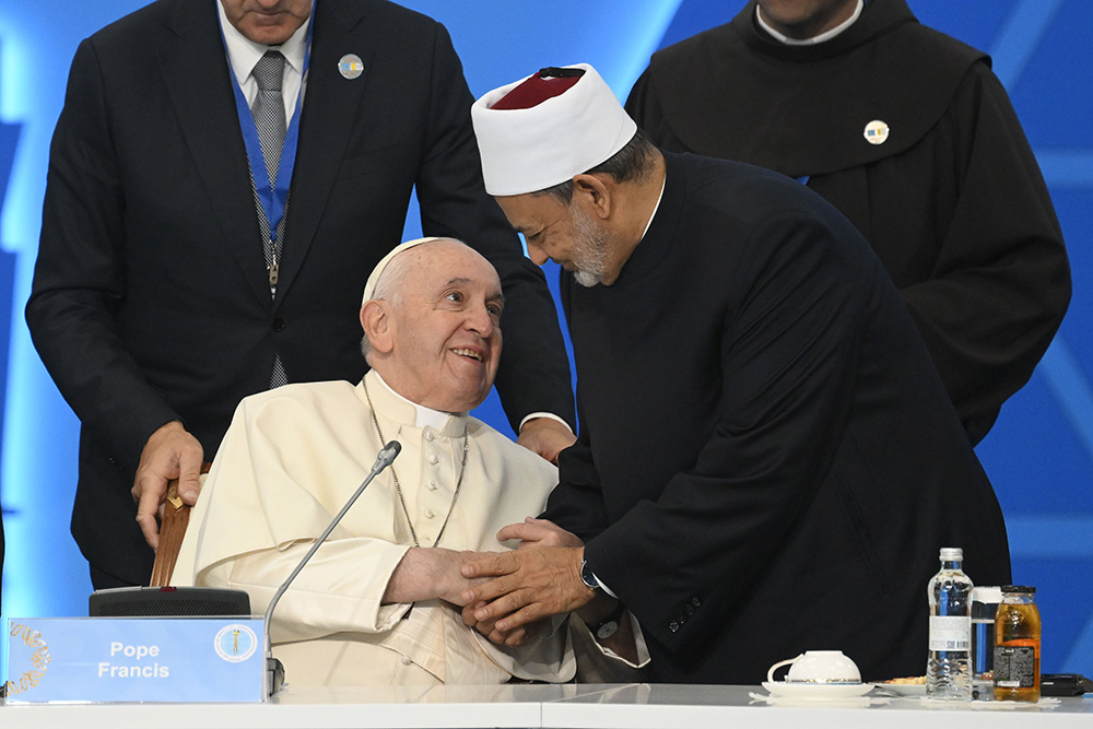 Pope Francis greets Sheikh Ahmad el-Tayeb, grand imam of Egypt's Al-Azhar mosque and university, during the Congress of Leaders of World and Traditional Religions at the Palace of Peace and Reconciliation in Nur-Sultan, Kazakhstan, Sept. 14, 2022. (CNS/Vatican Media)