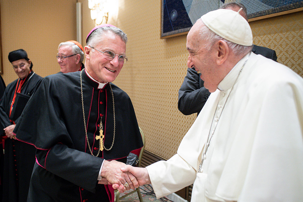 Pope Francis greets Archbishop Timothy Broglio, president of the U.S. Conference of Catholic Bishops, during a meeting with the presidents and coordinators of the regional assemblies of the Synod of Bishops at the Vatican Nov. 28, 2022. (CNS/Vatican Media)