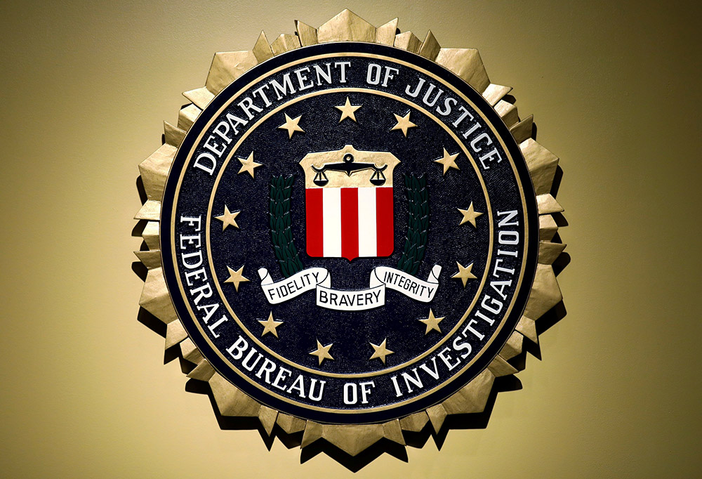 The Federal Bureau of Investigation seal is seen at FBI headquarters before a 2018 news conference in Washington. (OSV News/Reuters/Yuri Gripas)