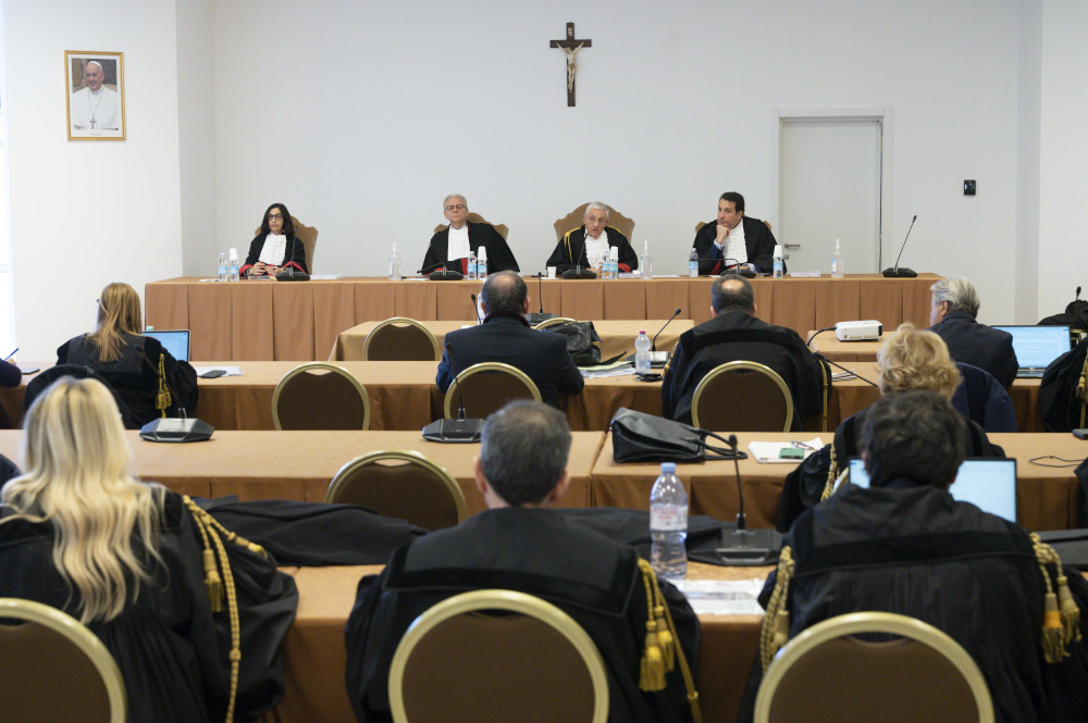 Lucia Bozzi, Venerando Marano, Giuseppe Pignatone and Carlo Bonzano, judges of the Vatican City State court, listen to presentations March 9, 2023, during the trial of Cardinal Angelo Becciu and nine other defendants on charges of financial malfeasance. The trial is being held in a makeshift courtroom at the Vatican Museums. (CNS photo/Vatican Media)