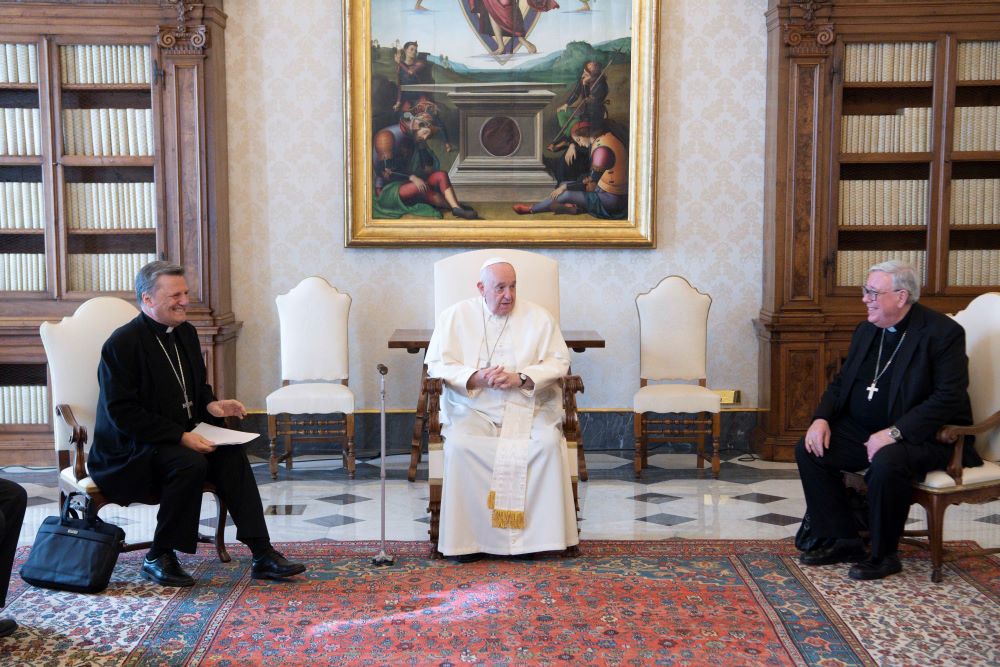 Pope Francis, at a meeting with members of the newly appointed preparatory commission for the general assembly of the Synod of Bishops at the Vatican March 16, 2023, sits between Cardinal Mario Grech, secretary-general of the Synod, and Cardinal Jean-Claude Hollerich of Luxembourg, general relator of the upcoming synod. (CNS photo/Vatican Media)