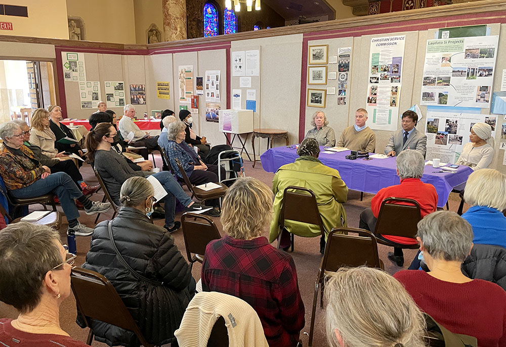 Panelists engage the room in conversation during the March 21 event titled "Detroit's Dirty Air: A Moral Response" at Gesu Catholic Church in Detroit. Panelists, from left, are Dominican Sr. Ellen Burkhardt, Jesuit Fr. Lorn Snow, U.S. Congressman Shri Thanedar and Laprisha Berry Daniels. (Amy Ketner)
