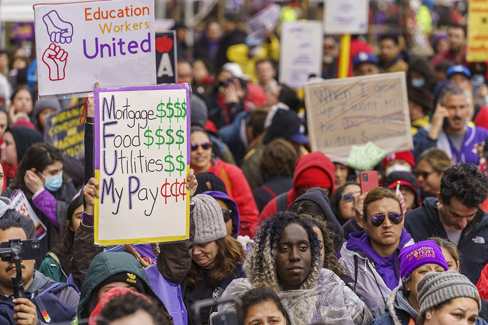 Thousands of Los Angeles Unified School District teachers and Service Employees International Union 99 members rally outside the school district headquarters in Los Angeles March 21. (AP Photo/Damian Dovarganes)