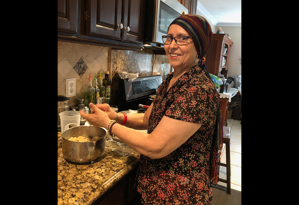 Maria de la Luz Arellano Miranda, Gustavo Arellano's mother, cooks gorditas for her family in 2018. She passed away a week after Easter four years ago from ovarian cancer at 69. (Courtesy of the Arellano family)