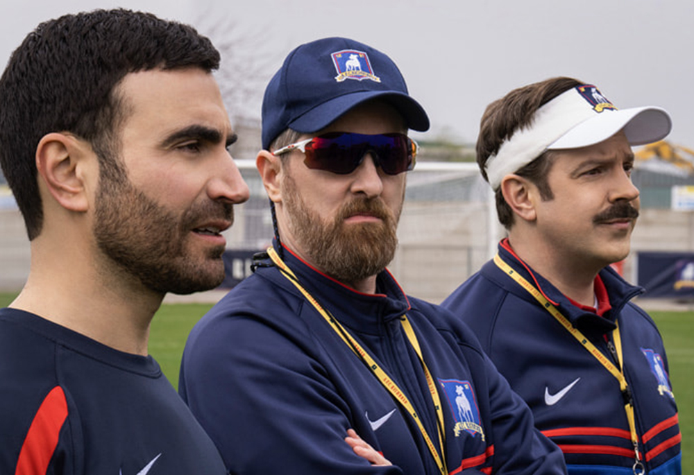 Brett Goldstein as Roy Kent, Brendan Hunt as Coach Beard, and Jason Sudeikis as the titular character in "Ted Lasso" (Courtesy of Apple TV+)