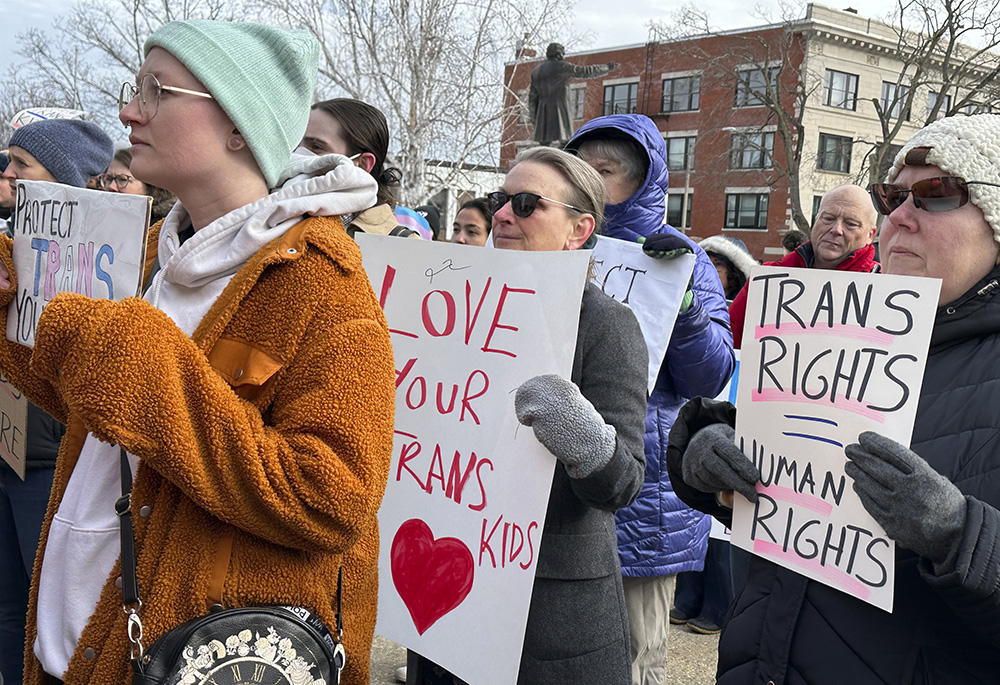 Advocates for transgender youth rally outside the New Hampshire Statehouse March 7 in Concord. House and Senate committees are holding public hearings on four bills opponents say would harm the health and safety of transgender youth. U.S. bishops issued a document March 20 rejecting gender-affirming medical treatments for transgender individuals. (AP photo/Holly Ramer)