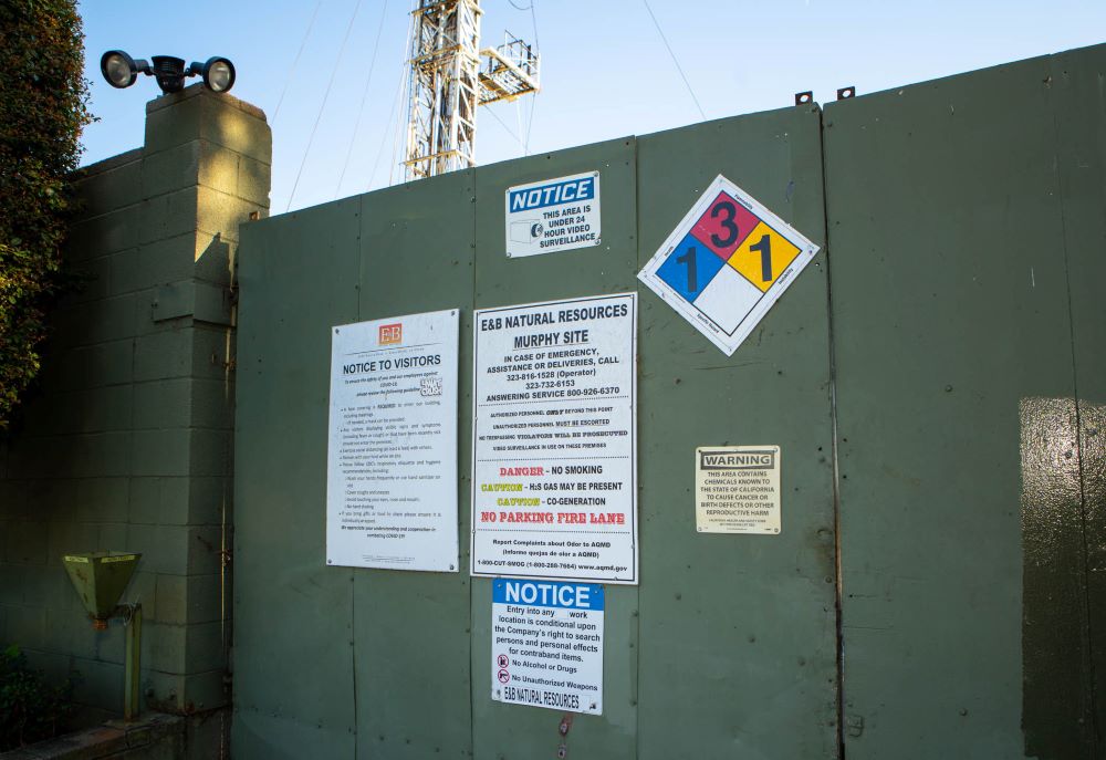 Signs on the Murphy Drill Site gate. (Capitol & Main/Isabel Avila)