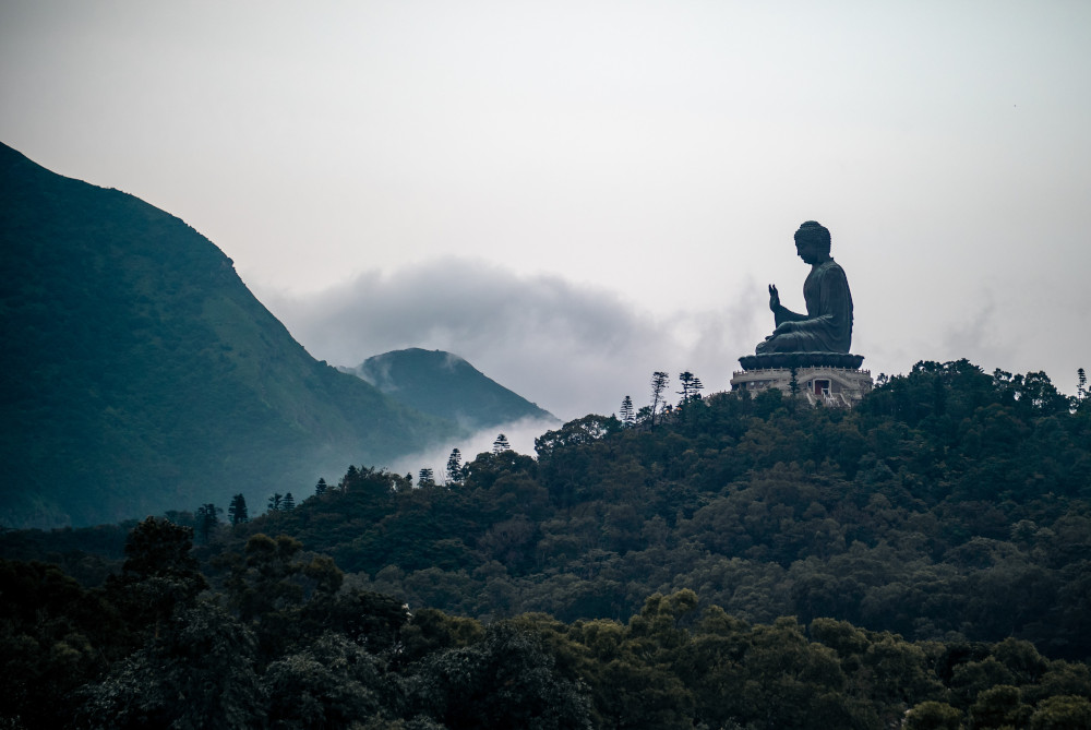 A statue of Buddha on a mountaintop (Jamie Street/Unsplash)