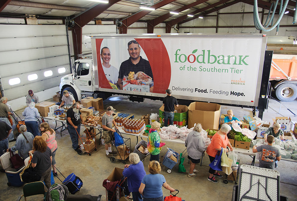 The walk-through setup of this mobile food pantry in Addison, New York, allows participants to select their own items, which aligns with the Food Bank of the Southern Tier's mission of encouraging personal choice in item selection. (Courtesy of Food Bank of the Southern Tier)