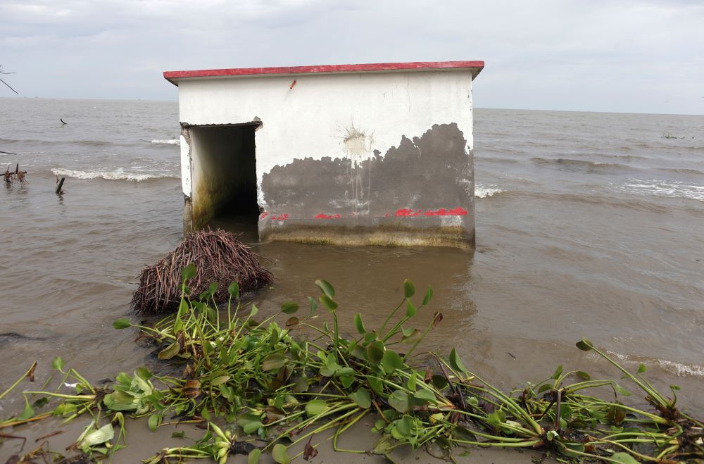 A house is flooded with sea water in El Bosque, Mexico, Nov. 7, 2022. Rising sea levels are destroying homes built on the shoreline and forcing villagers to relocate. (CNS photo/Reuters/Gustavo Graf)