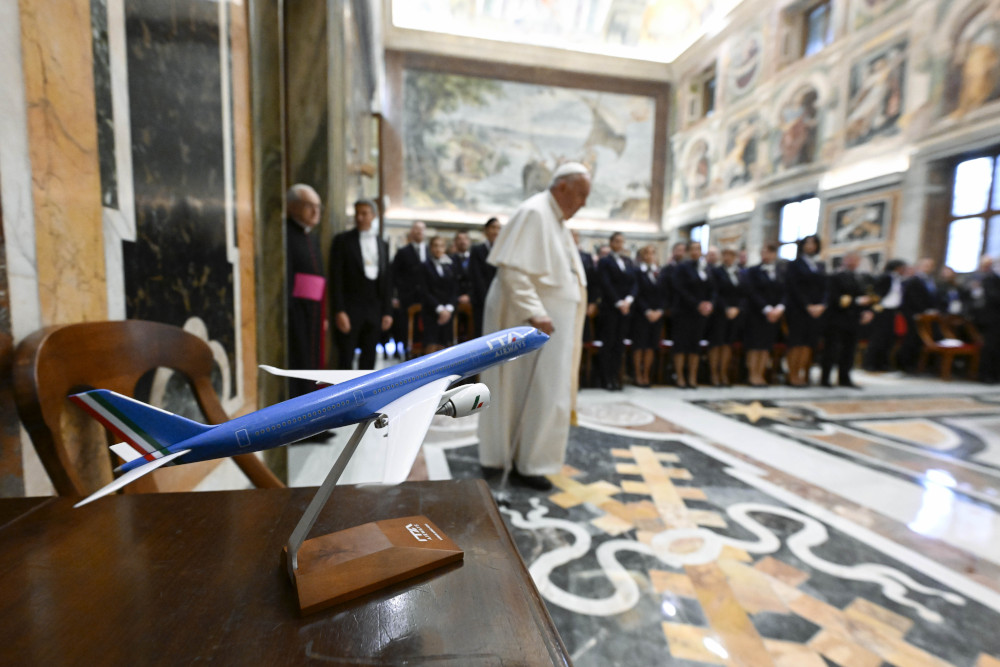 Pope Francis arrives in the Clementine Hall of the Apostolic Palace at the Vatican April 14, 2023, for an audience with executives and staff of ITA Airways, the Italian government-owned airline that flies the pope on his trips abroad. (CNS photo/Vatican Media)