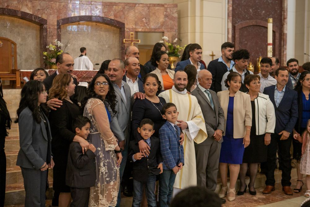 Deacon J. Serrato poses for a group photo after his Mass of ordination to the transitional diaconate May 14, 2022, at the Co-Cathedral of the Sacred Heart in Houston. (CNS/Texas Catholic Herald/James Ramos)