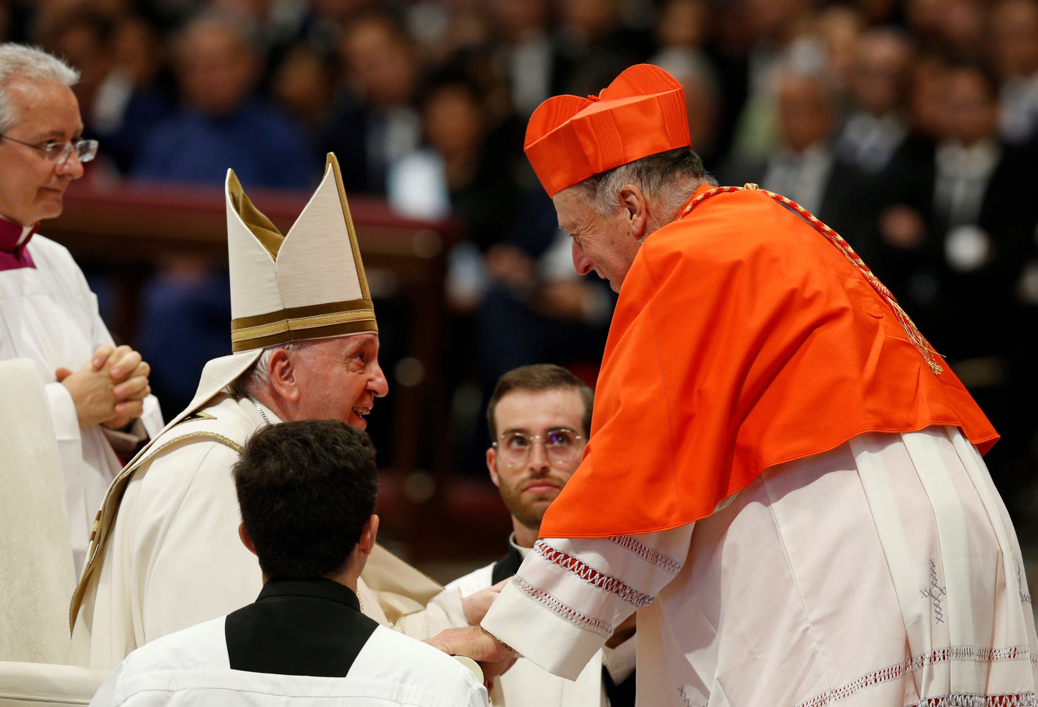 Pope Francis talks with San Diego Cardinal Robert McElroy after presenting the red biretta to him during a consistory for the creation of 20 new cardinals in St. Peter's Basilica at the Vatican Aug. 27, 2022. (CNS/Paul Haring)