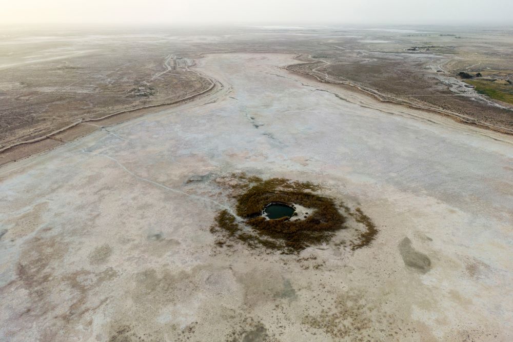 A dried Sawa Lake is surrounded by a dry bed in Iraq, Monday, April 10, 2023. (AP Photo/Anmar Khalil)