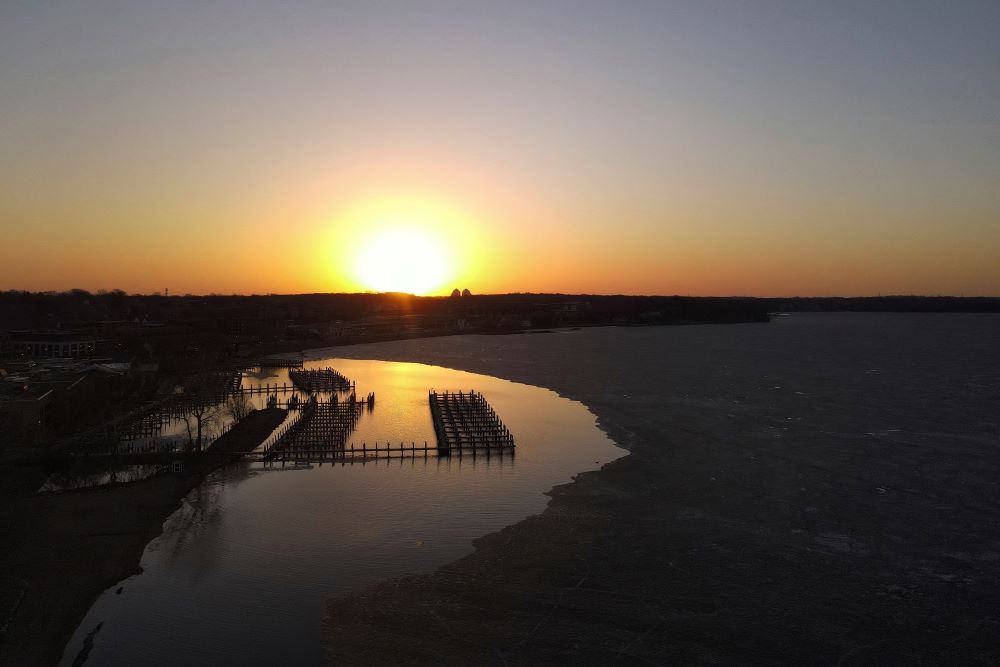 Boat docks are visible where ice has thawed at Wayzata Bay in Lake Minnetonka, Thursday, April 13, 2023, in Wayzata, Minn. (AP Photo/Abbie Parr)