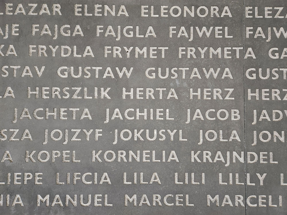 A wall of popular given Jewish names of the time at Bełżec in Poland; no family names are presented. (NCR photo/Chris Herlinger)