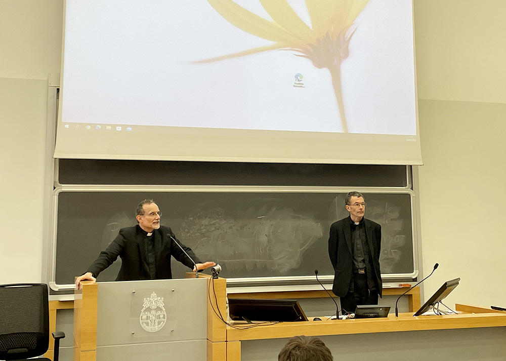 German Jesuit Fr. Philip Renczes, left, presents next year's seminar offerings for the newly launched ecumenical studies program at the Pontifical Gregorian University in Rome. (NCR photo/Christopher White)