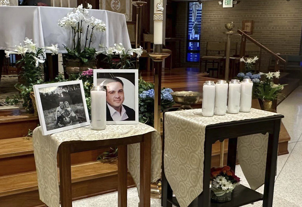 A memorial for Joshua Barrick is on display, late Monday, April 10 at Holy Trinity Catholic Church in Louisville, Kentucky. A Louisville bank employee armed with a rifle opened fire at the bank Monday morning, killing Barrick and multiple others, including a close friend of Kentucky's governor, while livestreaming the attack on Instagram, authorities said. (AP photo/Claire Galofaro)