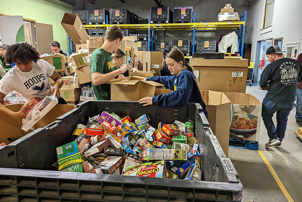 Volunteers sort dry bulk items at the Food Bank of the Southern Tier’s MLK Day of Service event. More than 160 volunteers participated in the event on Jan. 16 this year. (Courtesy of Food Bank of the Southern Tier)