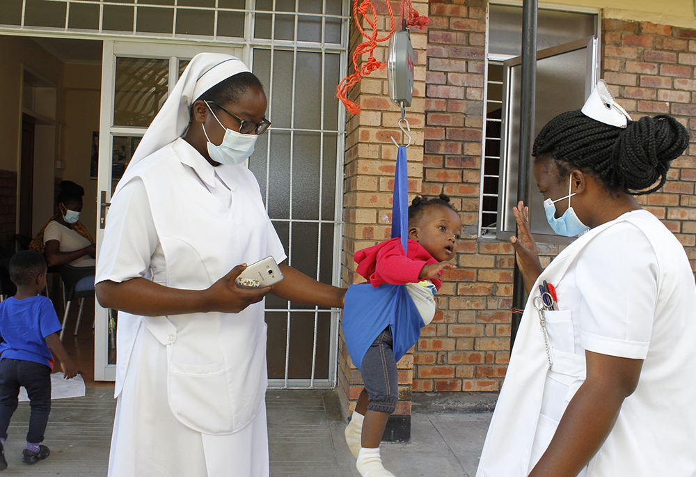 Sisters and health care workers attending to their duties at the "under five" clinic of the medical facility of Our Lady's Health Centre. (Courtesy of Our Lady's Health Centre)