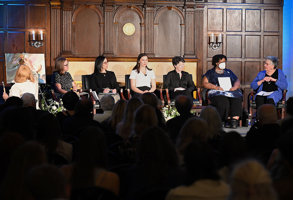 The panel is pictured for the April 17 event "Faith, Feminism, and Being Unfinished: The Question of Women's Ordination" at Georgetown University. From left: Annie Selak; Teresa Delgado; Lin Henke; Alice McDermott; Angele Cabrini White; and Mary Hunt. (Courtesy of Georgetown University/Leslie E. Kossoff)