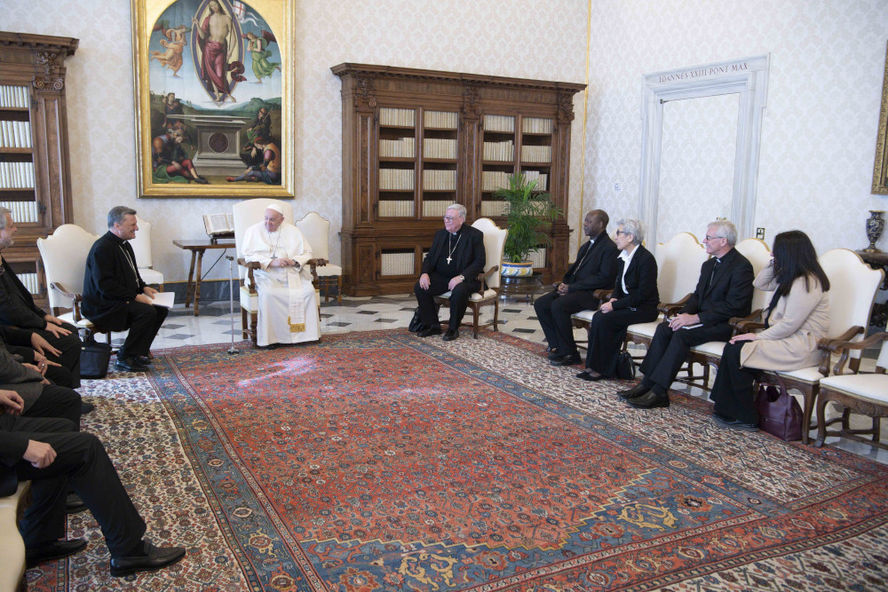 Pope Francis meets with members of the preparatory commission for the general assembly of the Synod of Bishops in the library of the Apostolic Palace at the Vatican March 16. Pictured to the right of the pope are: Cardinal Jean-Claude Hollerich of Luxembourg, general relator of the upcoming synod; Bishop Lucio Muandula of Xai-Xai, Mozambique; Mercedarian Sister Shizue "Filo" Hirota from Tokyo; Archbishop Timothy Costelloe of Perth, president of the Australian bishops' conference; and a synod staff member. (