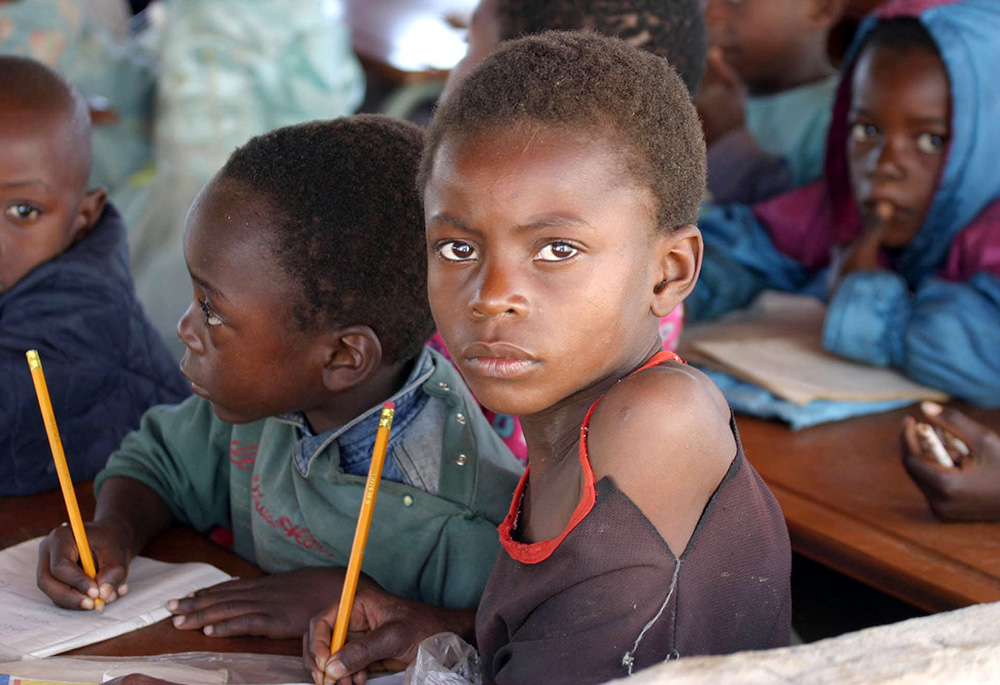 Zambian children attend school in a poverty-stricken area near the country's capital, Lusaka, July 1, 2005. (CNS/Reuters)