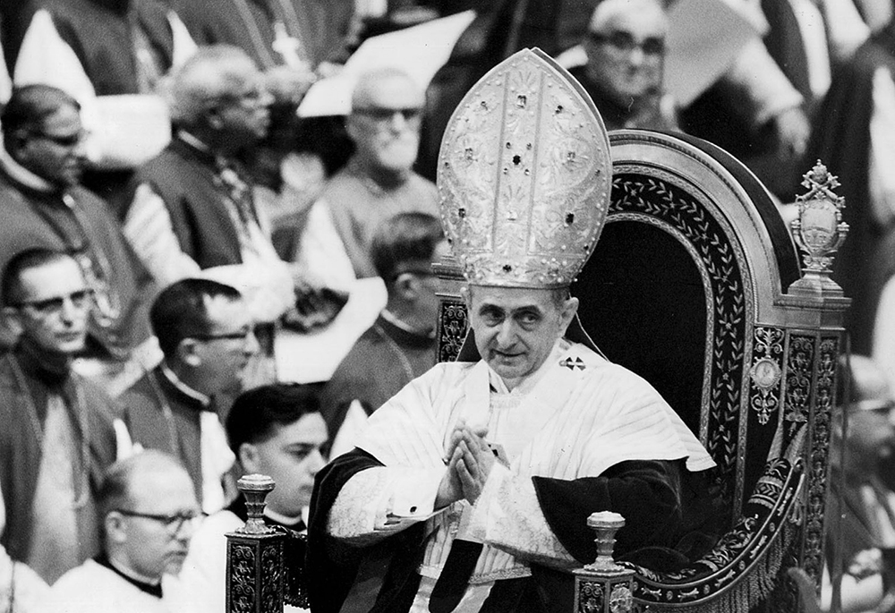 Pope Paul VI makes his way past bishops during a session of the Second Vatican Council in 1964. Vatican II, in its Dogmatic Constitution on the Church (Lumen Gentium) promulgated by Blessed Paul VI on Nov. 21, 1964, presents succinctly the church's teaching on the role of the laity in the church and in the world. (CNS file photo) 